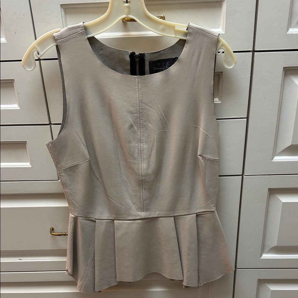 Leather top with peplum skirt